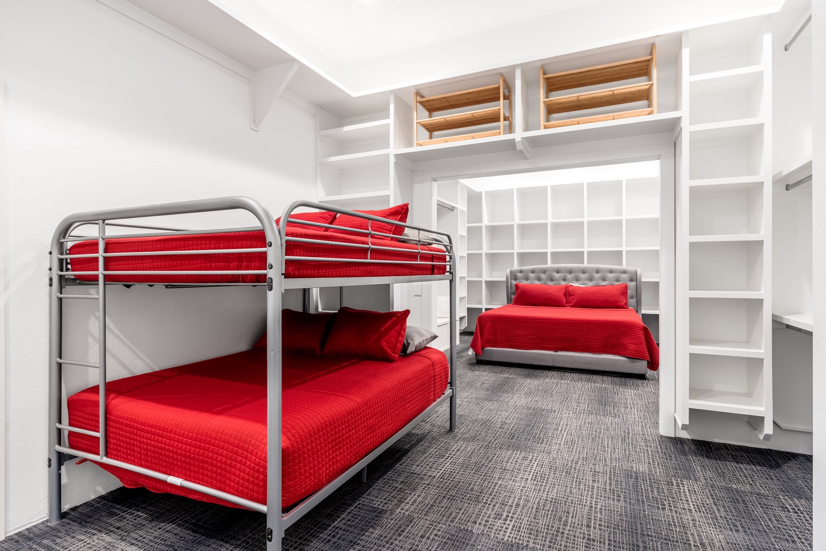 Plenty of room for everyone! This spacious bedroom offers comfy bunk beds and a separate queen, perfect for families or groups who want to stay close yet have their own cozy spots.