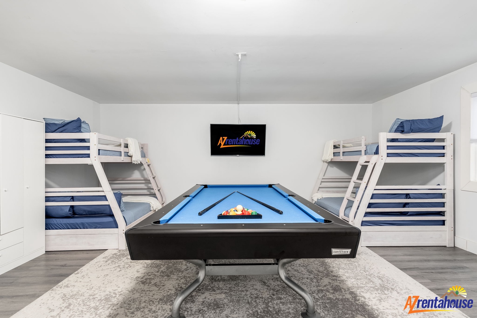 Your game room dreams come true with twin bunk beds and a pool table for endless fun.
