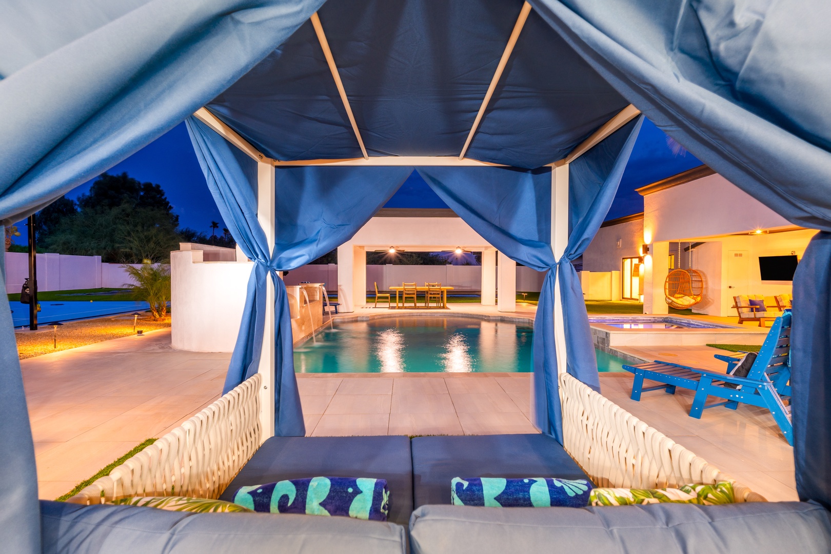 Slip into your private cabana and watch the evening glow dance across the pool, where modern luxury meets total relaxation just steps from your door.