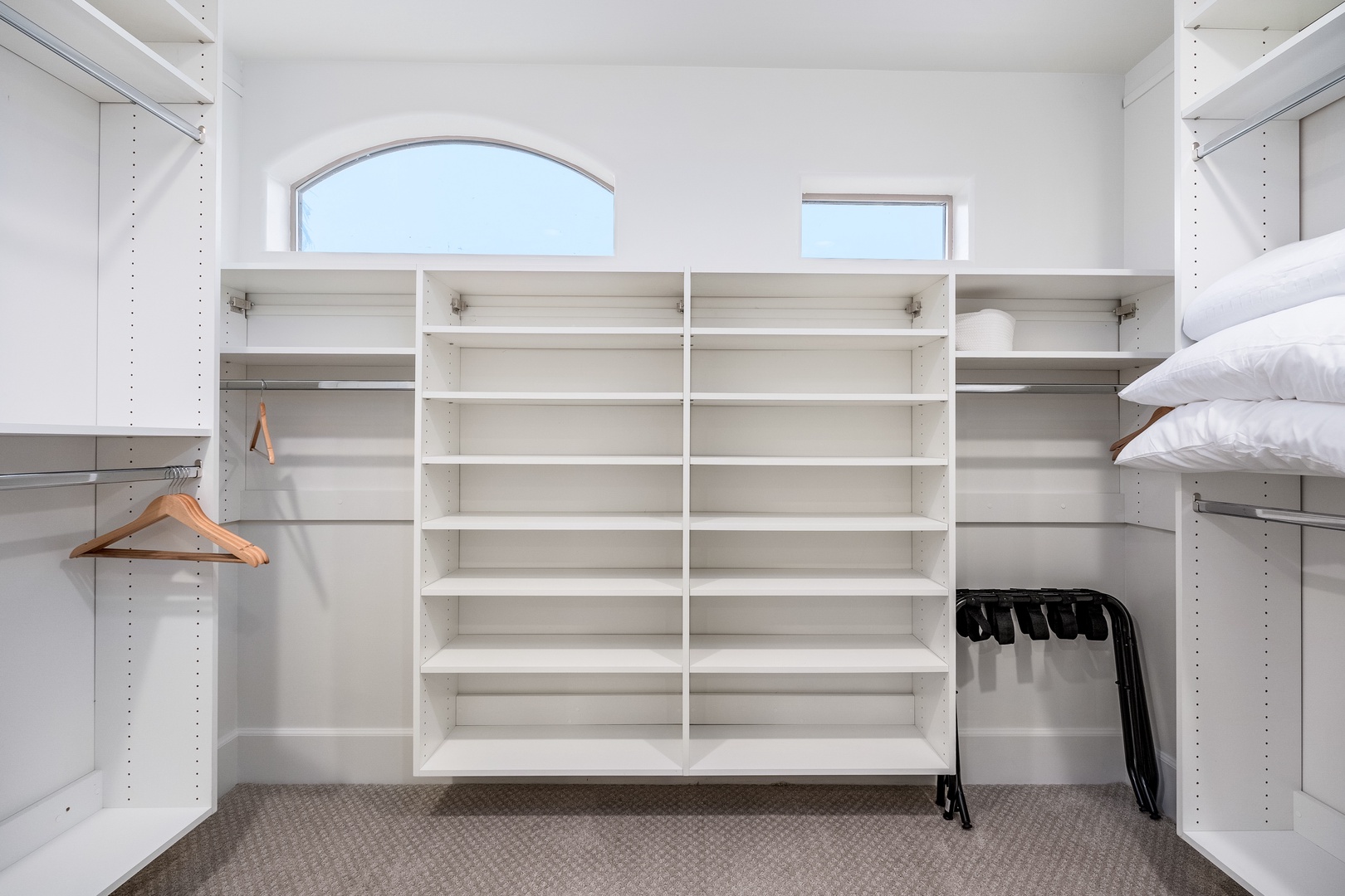 Unpack and settle in with ease—your spacious walk-in closet features custom shelving, hanging rods, and plenty of room for all your vacation essentials.