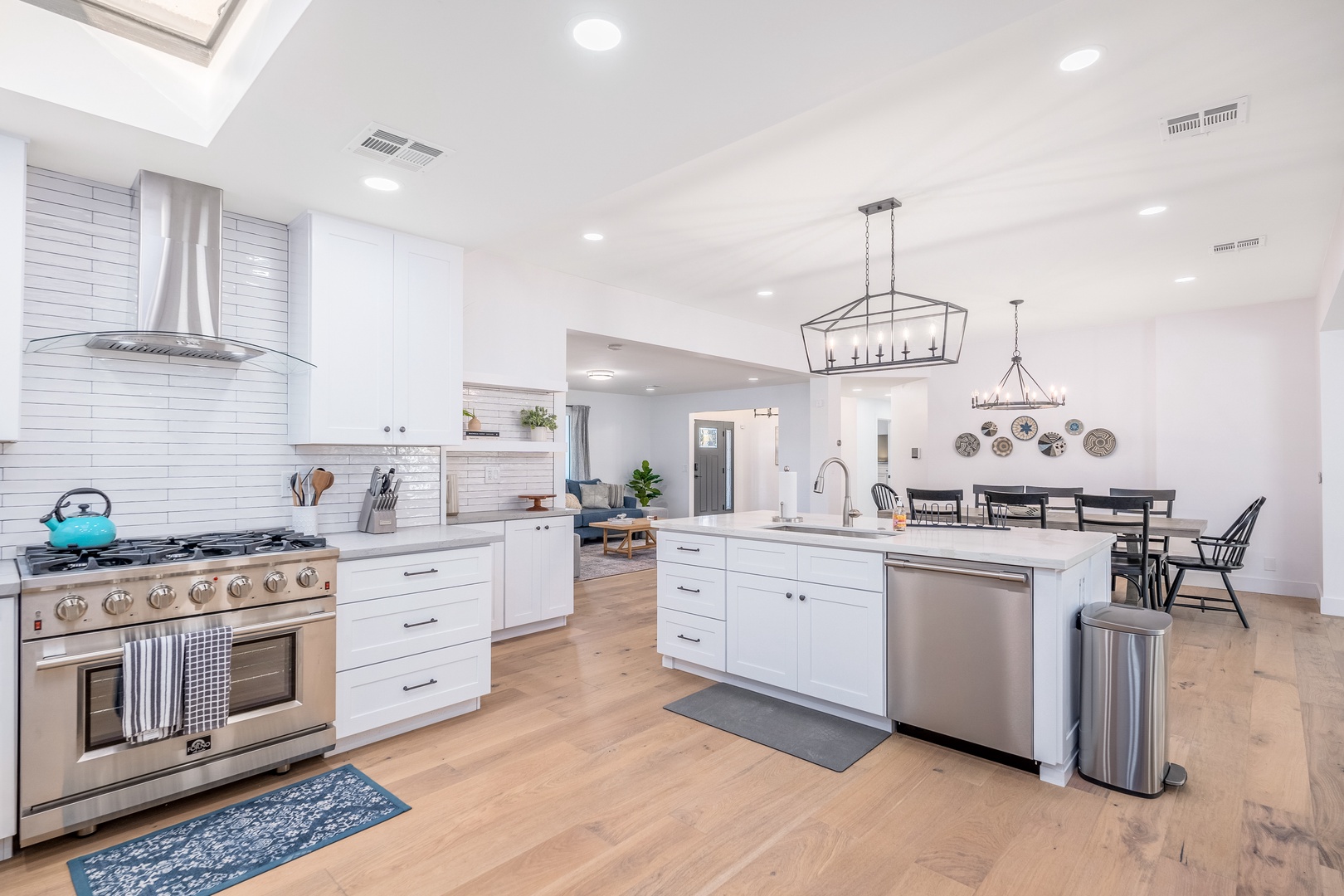 You'll love cooking in this bright, modern kitchen with high-end appliances, a spacious island, and an open layout perfect for gathering with family and friends.