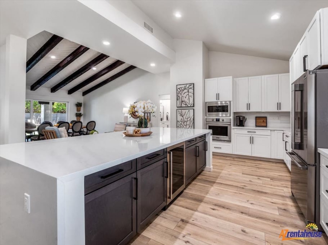 Cook in your spacious gourmet kitchen with elegant exposed beams, granite counters, and premium appliances perfect for memorable meals.