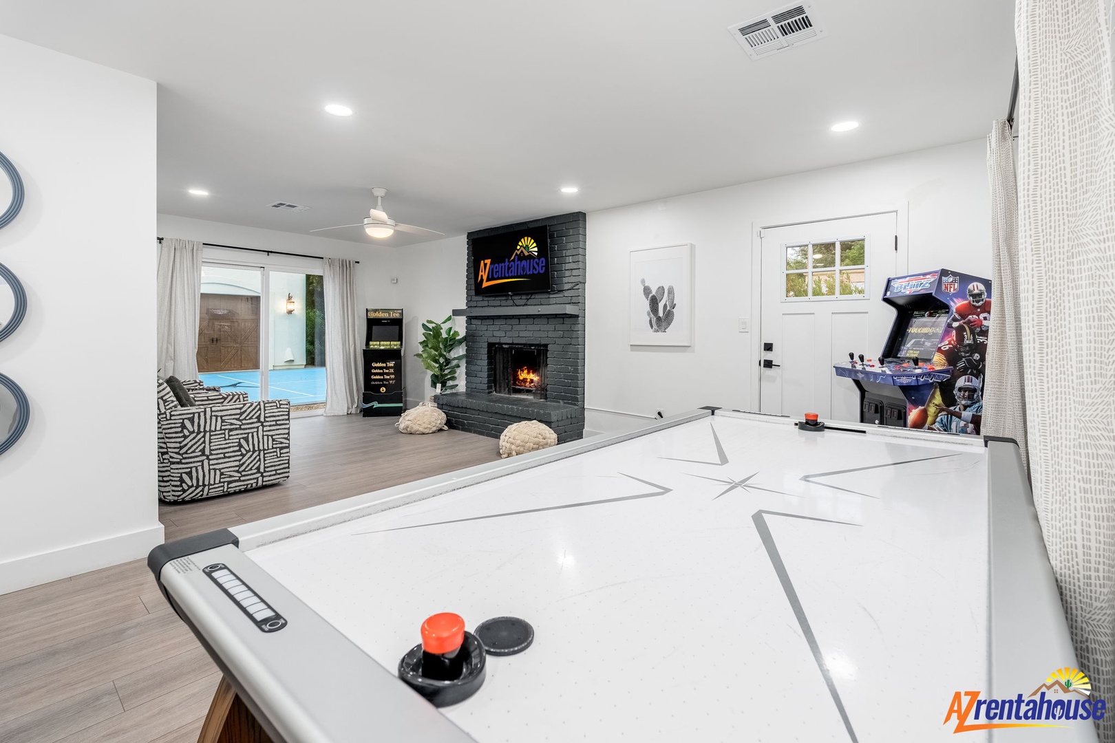 Your game room awaits with air hockey, arcade fun, and cozy fireplace for perfect group entertainment nights.