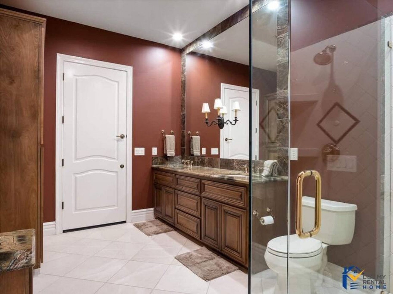 Step into your elegant bathroom where rich burgundy walls and marble accents create a spa-like retreat for your daily routine.