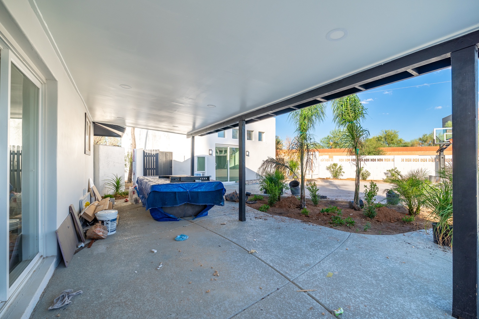 Step outside to your covered patio with fresh landscaping, a perfect spot to relax or dine while enjoying desert sunshine and open skies.