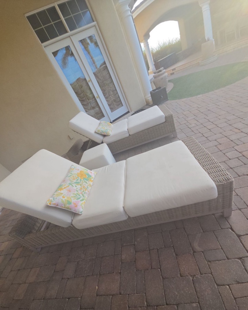 Stretch out on plush poolside loungers with soft cushions and cheerful pillows. Your private patio offers easy access to the shimmering pool and a peaceful spot to soak up the sun.