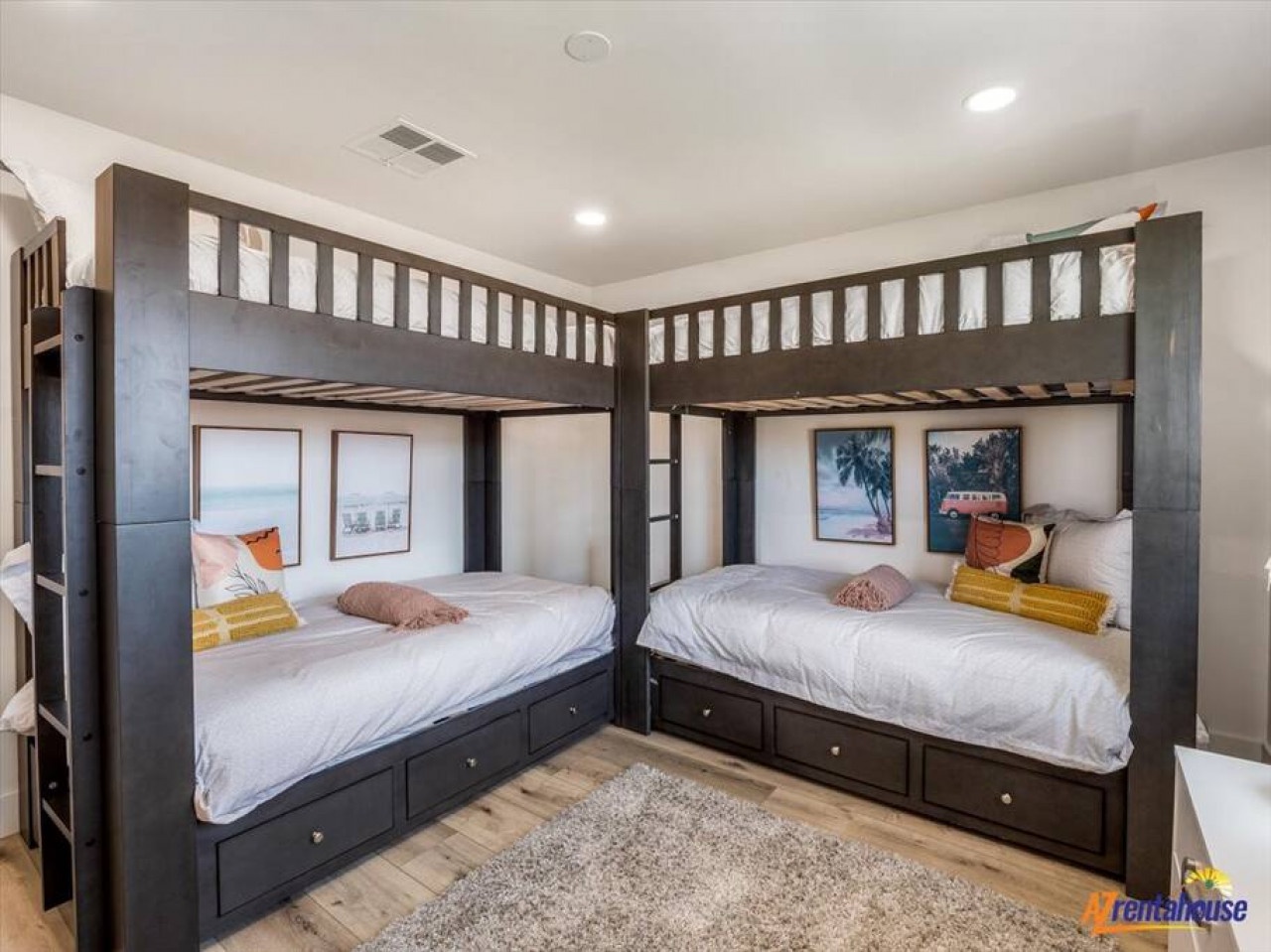 Your kids will love these custom-built corner bunk beds with built-in storage drawers and cozy reading nooks underneath.