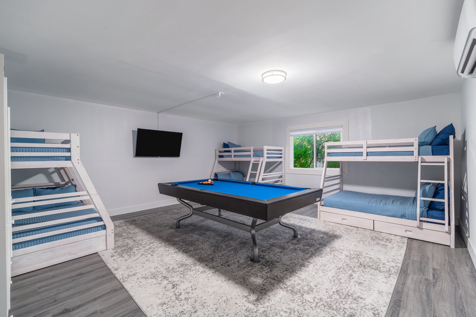 Your private entertainment space features three bunk beds and a full-sized pool table—perfect for family fun, late-night games, or quiet downtime between adventures.