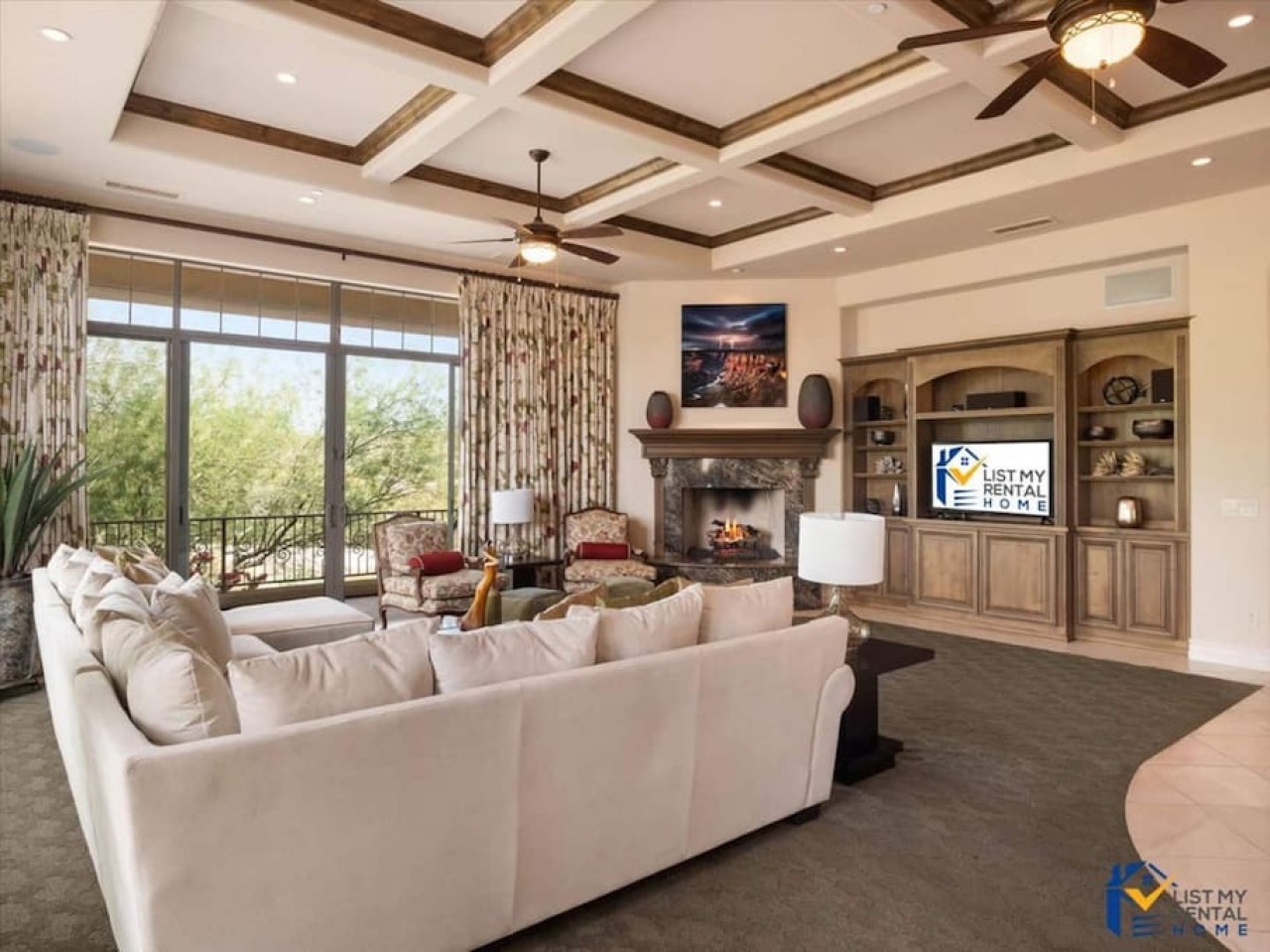 Gather with loved ones in this elegant living space featuring exposed wood beams and a cozy fireplace.