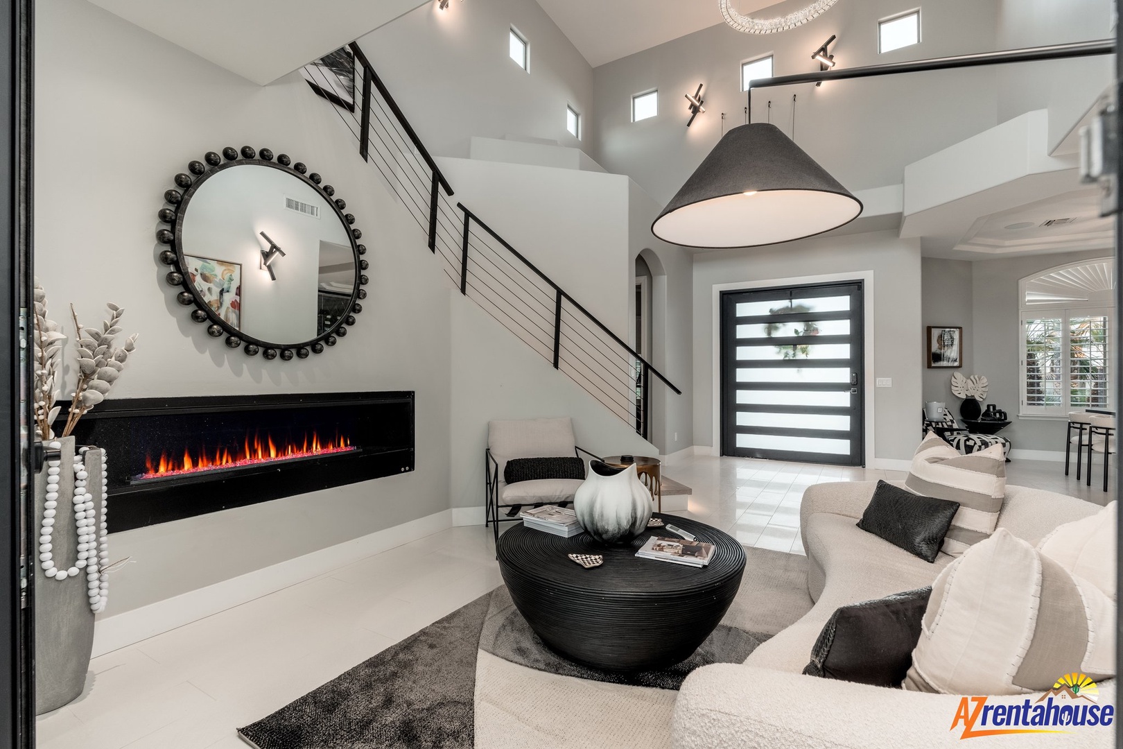 Step into your elegant living space where modern sophistication meets cozy comfort, featuring a stunning fireplace and stylish design perfect for relaxing.