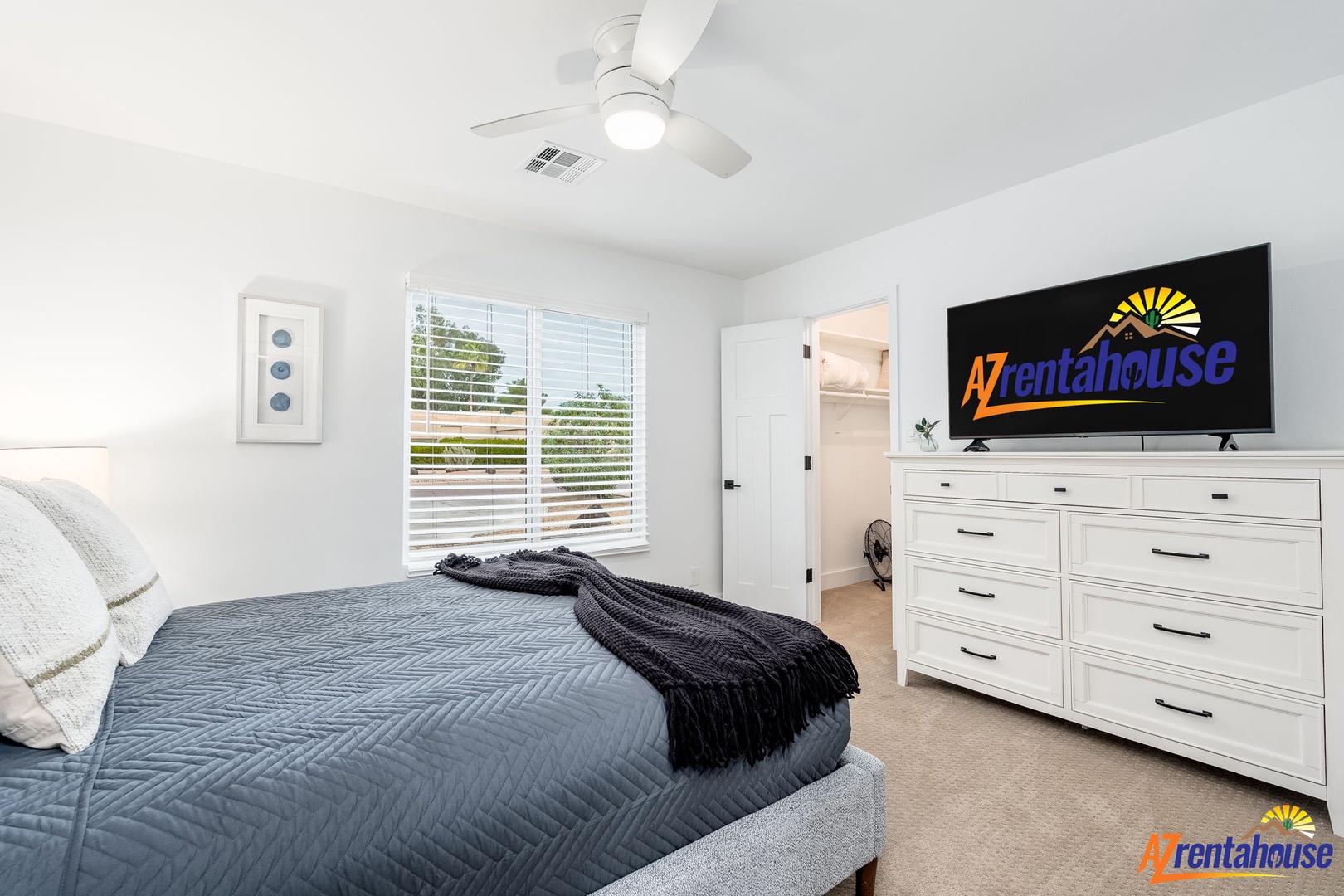 Sink into crisp linens and enjoy your favorite shows on the wall-mounted TV in this peaceful bedroom retreat.