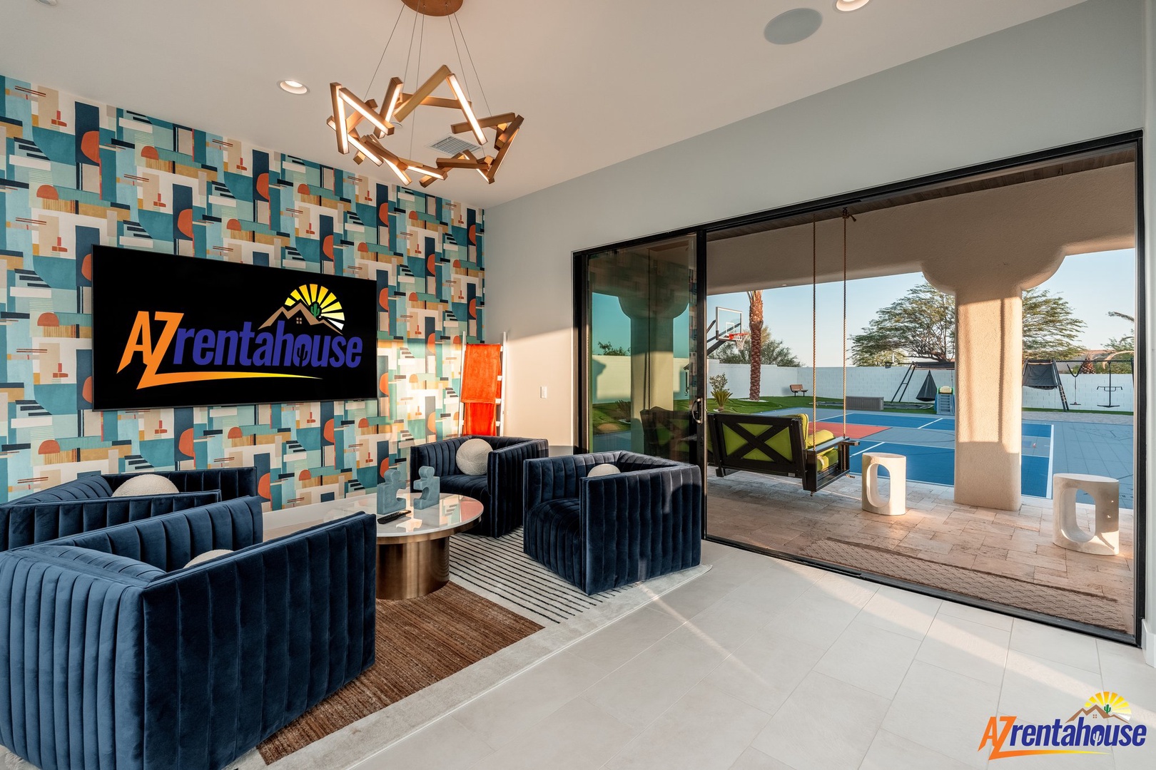 Your modern retreat features plush navy seating and opens to a sparkling pool oasis for ultimate relaxation.