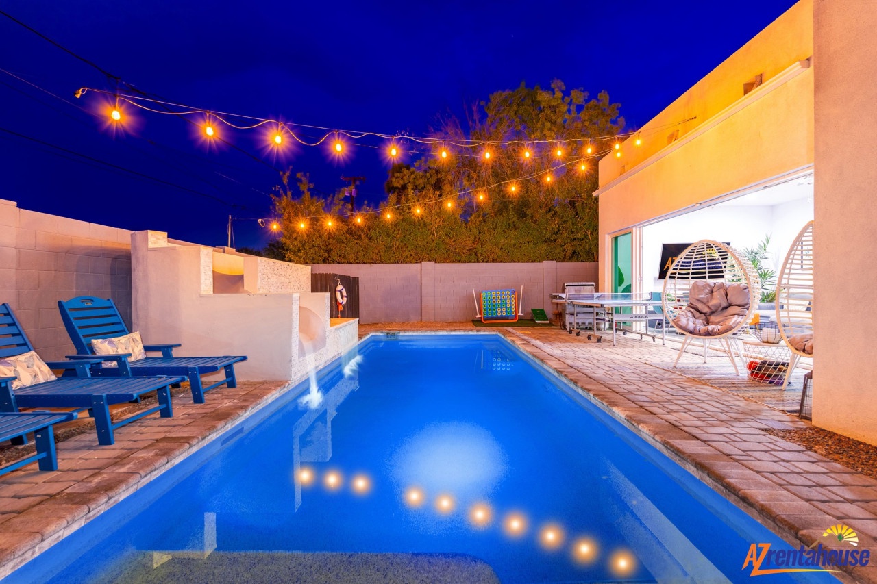 Dive into your private oasis where twinkling lights dance above crystal-clear waters, creating the perfect evening ambiance for relaxation.