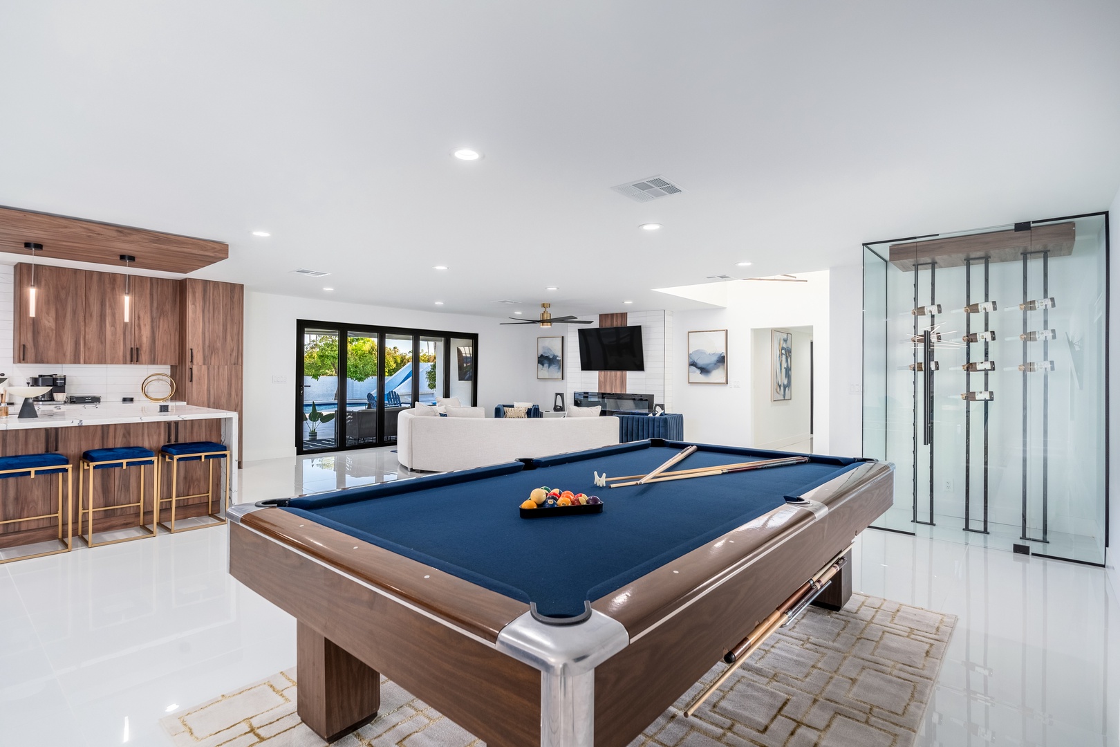 Challenge friends to a game on your sleek pool table, unwind at the bar with a drink, or relax in the stylish lounge—perfect for entertaining or unwinding.