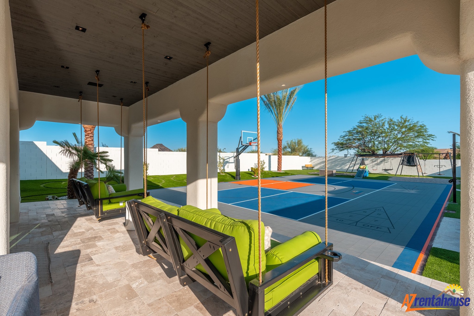Swing into relaxation on your private patio, overlooking a full basketball court perfect for family games and afternoon fun.