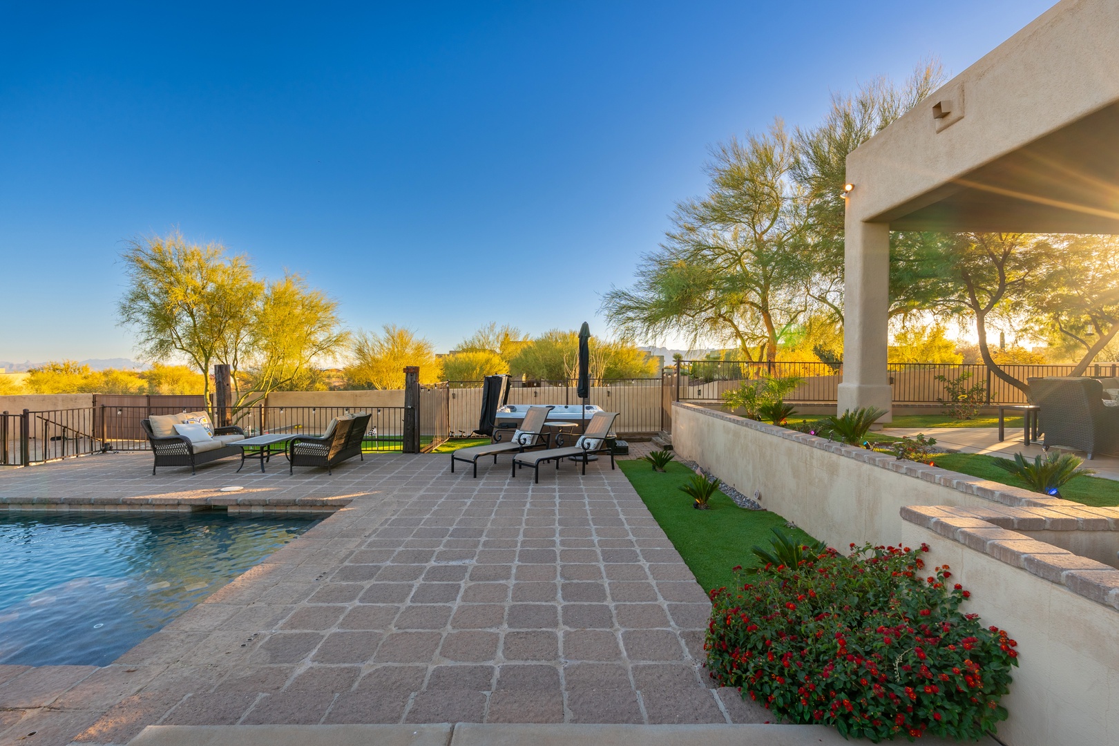 Relax by your private pool and soak in golden desert sunsets, surrounded by vibrant greenery and serene mountain views.