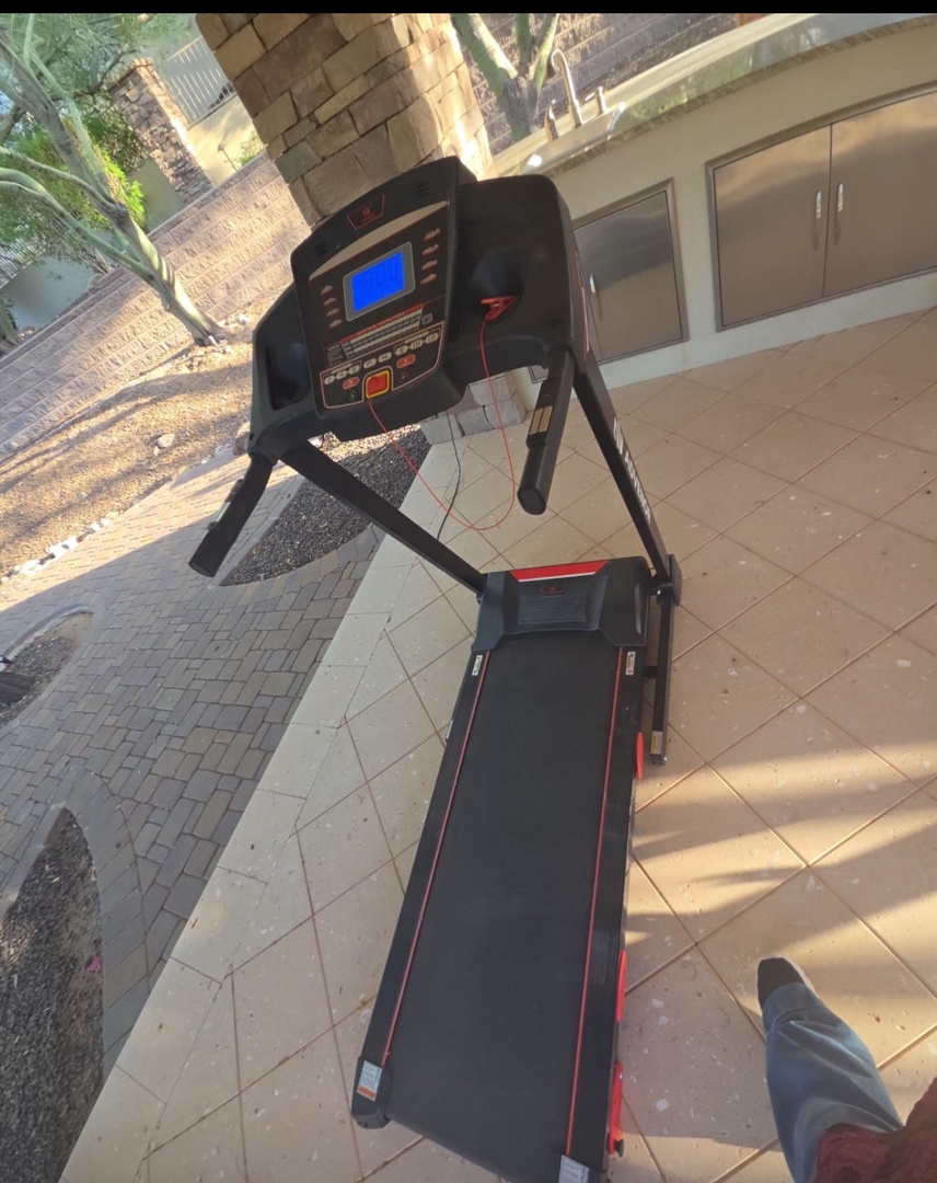 Stay active and enjoy your morning workout on this treadmill, perfectly positioned on your private patio with refreshing garden views to energize your routine.