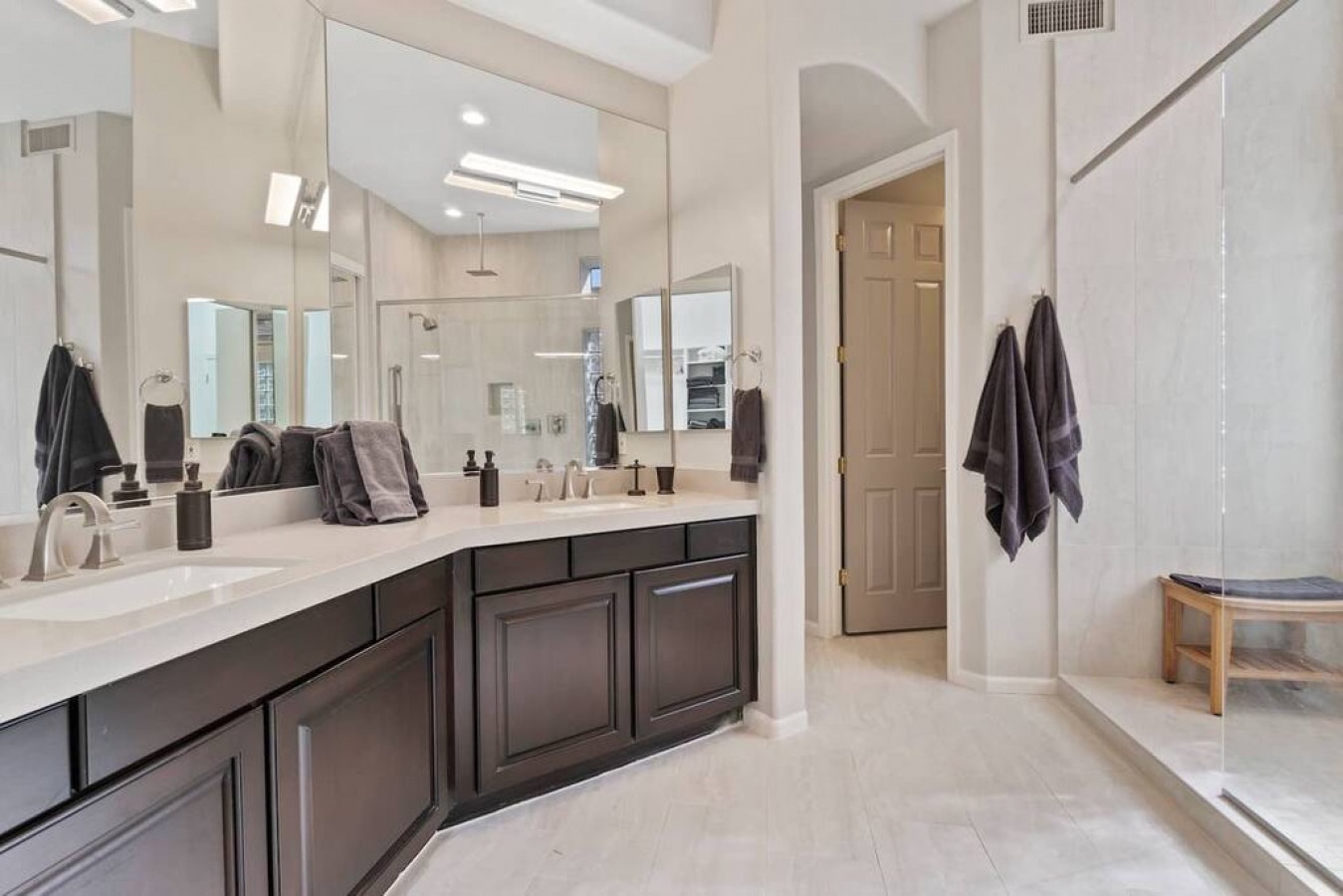 Unwind in your luxurious master bathroom with dual vanities, elegant marble countertops, and spa-like lighting for your perfect morning routine.