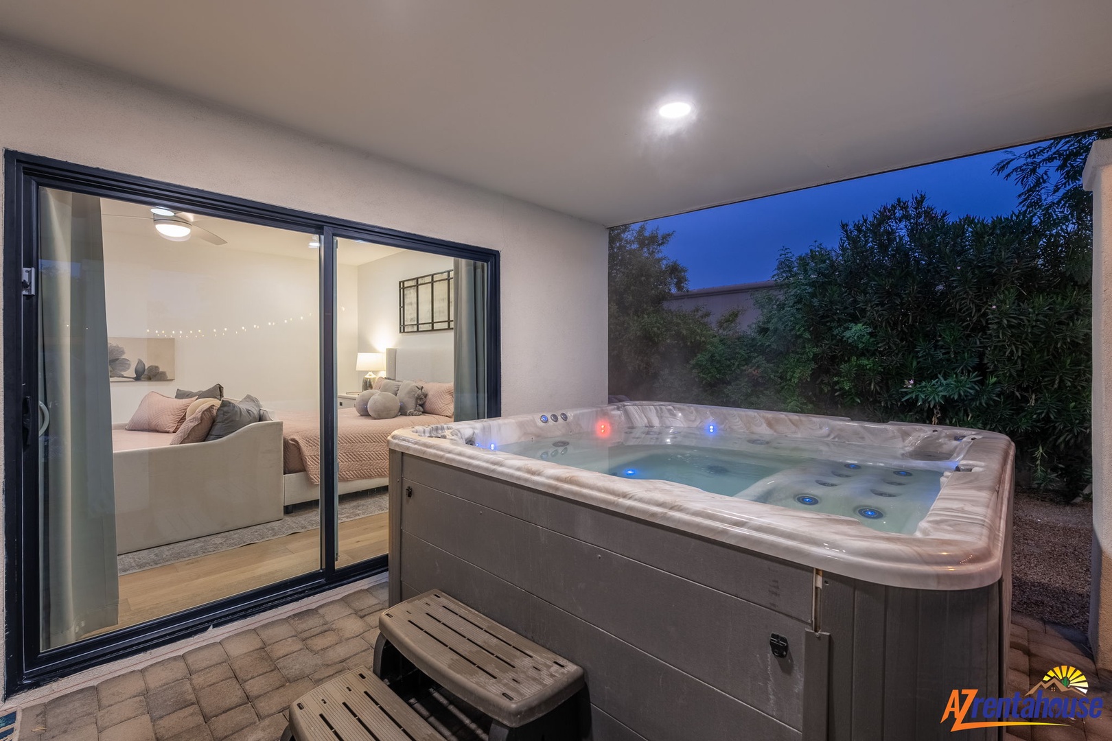 Your private hot tub awaits under the stars, just steps from your cozy bedroom—perfect for unwinding after exploring.
