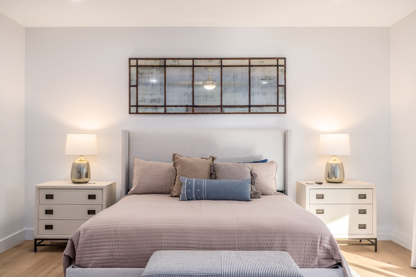 Sink into plush pillows and soft linens in your serene bedroom retreat. Warm bedside lamps and elegant décor create the perfect ambiance for restful nights.