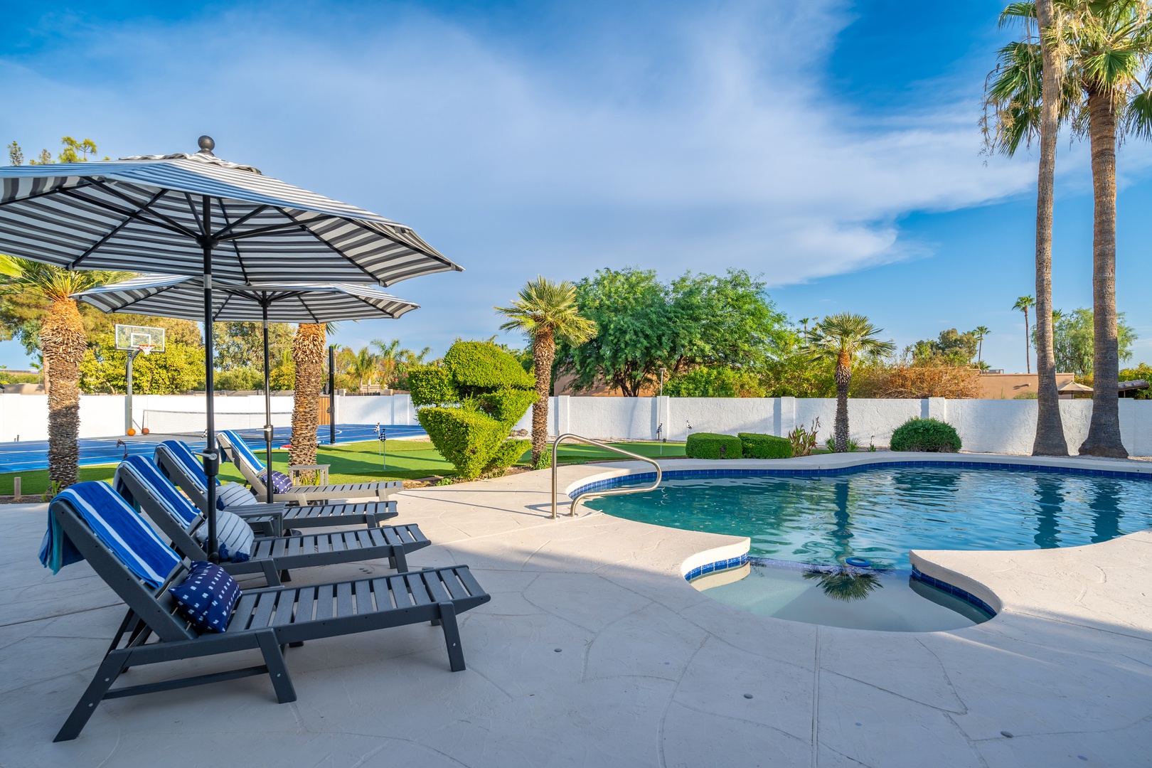 Stretch out on cushioned loungers by your private pool, surrounded by swaying palms and desert sunshine. The perfect spot to soak up the warmth and unwind.