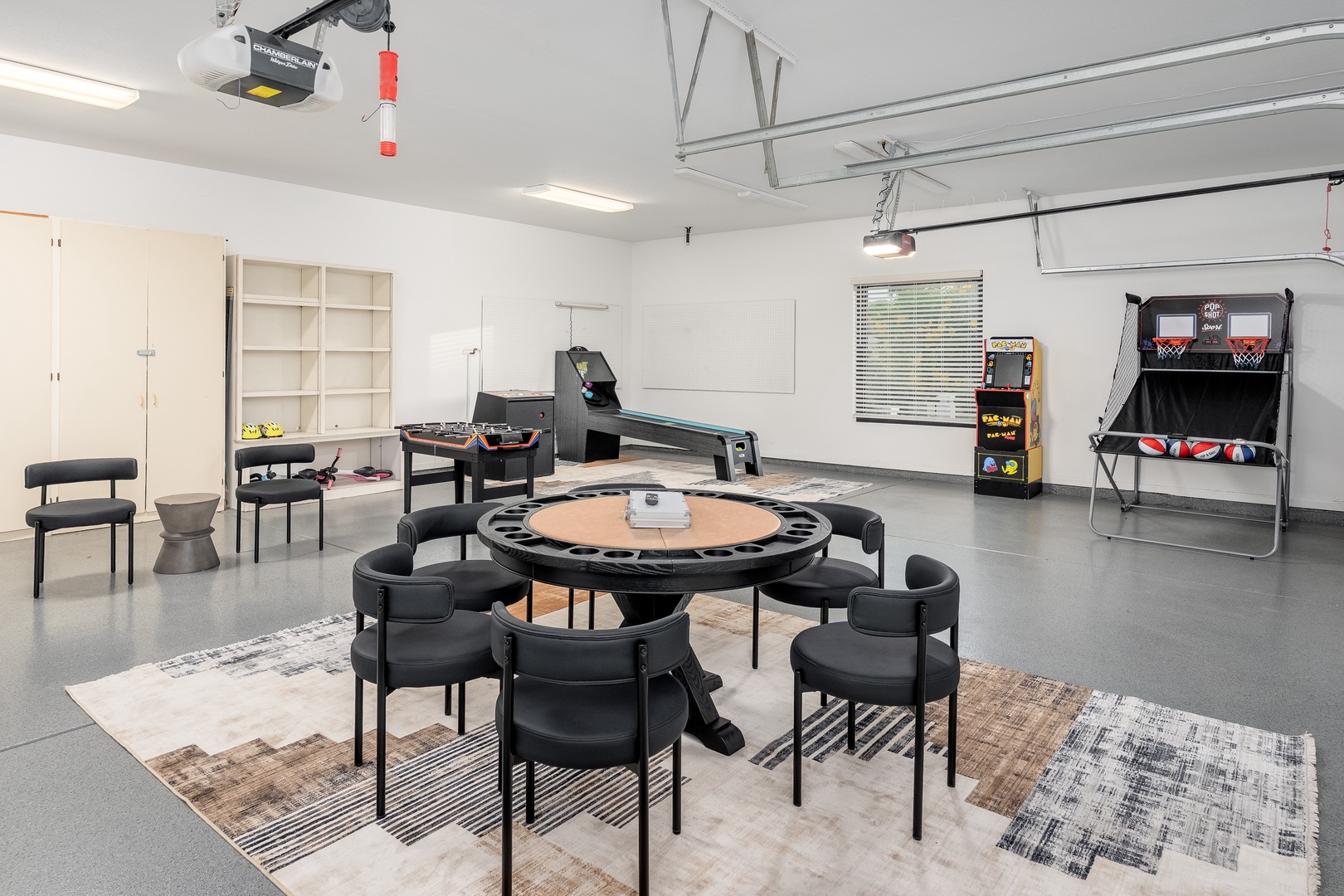 Your private game room awaits with everything you need: arcade fun, hoops, table games, and plenty of seating for the whole crew to relax and compete together.