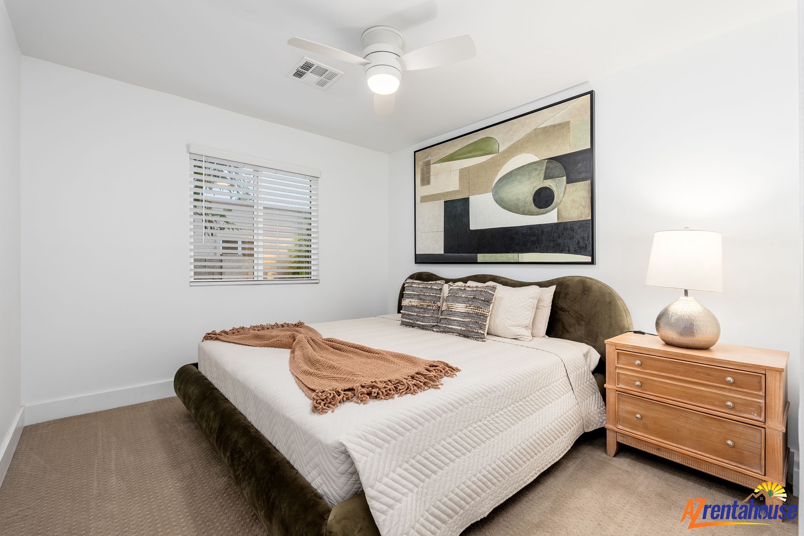 Rest peacefully in your stylish bedroom with plush bedding, modern artwork, and warm lighting creating the perfect sanctuary.