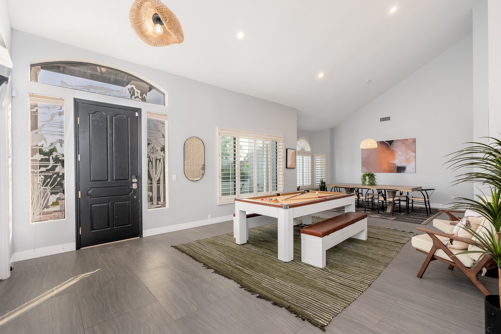 Step inside your bright, open-concept retreat where modern comfort meets laid-back style. Gather around the shuffleboard table or relax in seating areas bathed in natural light—your perfect backdrop for making memories.