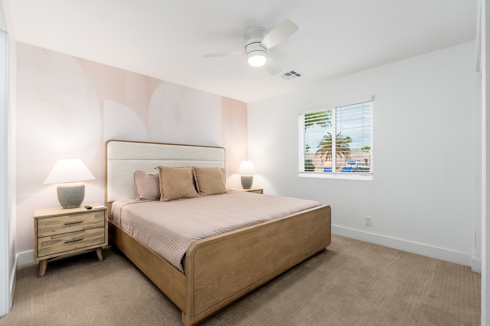 Unwind in your serene bedroom with soft lighting, cozy linens, and a peaceful view—your perfect retreat after a day of adventure.