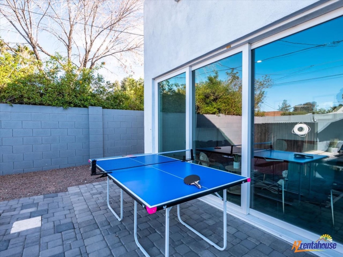 Challenge friends to ping pong matches on your private patio, surrounded by lush greenery and modern comfort.