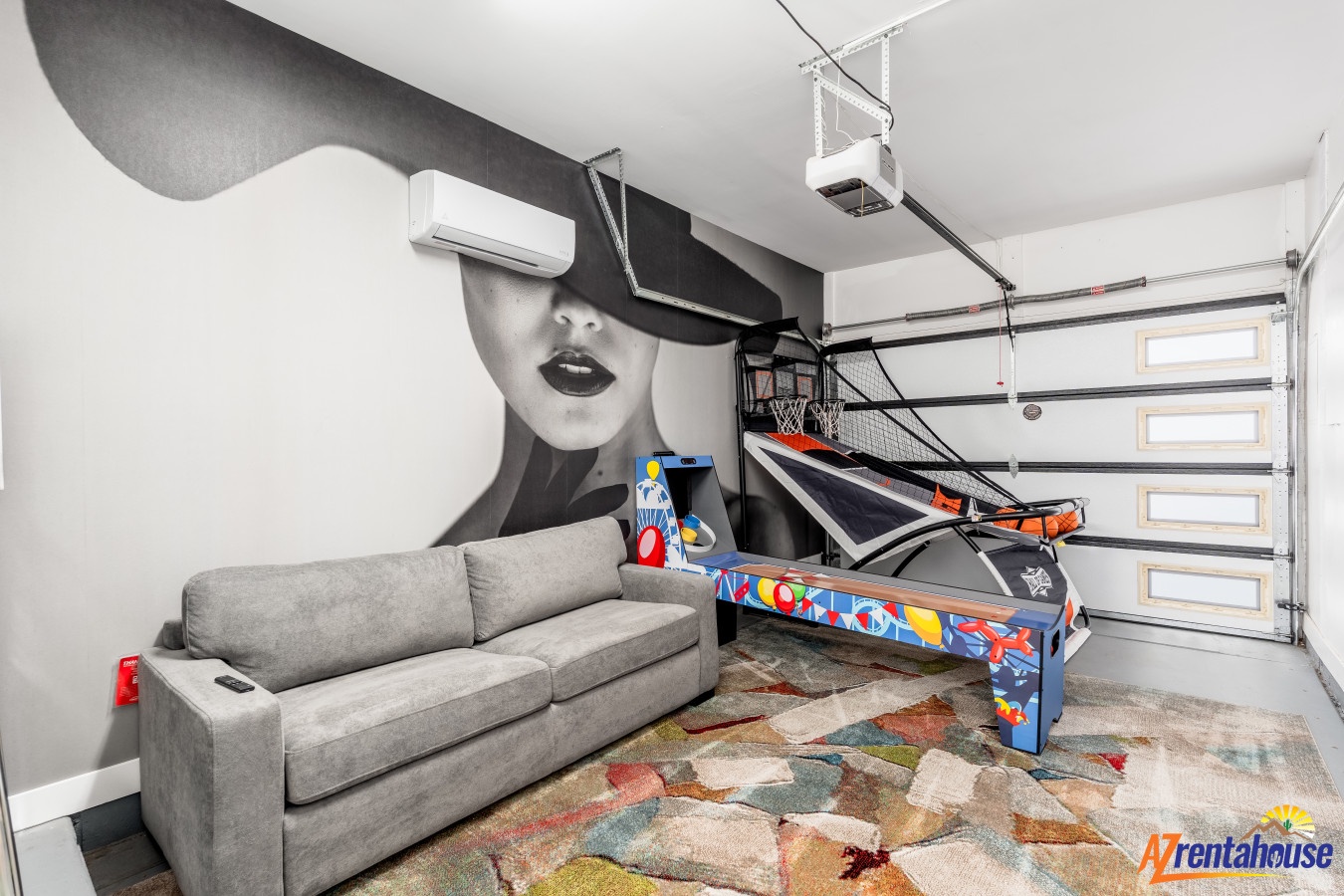 Your ultimate game room awaits with air hockey, basketball hoops, and stylish wall art for endless entertainment.