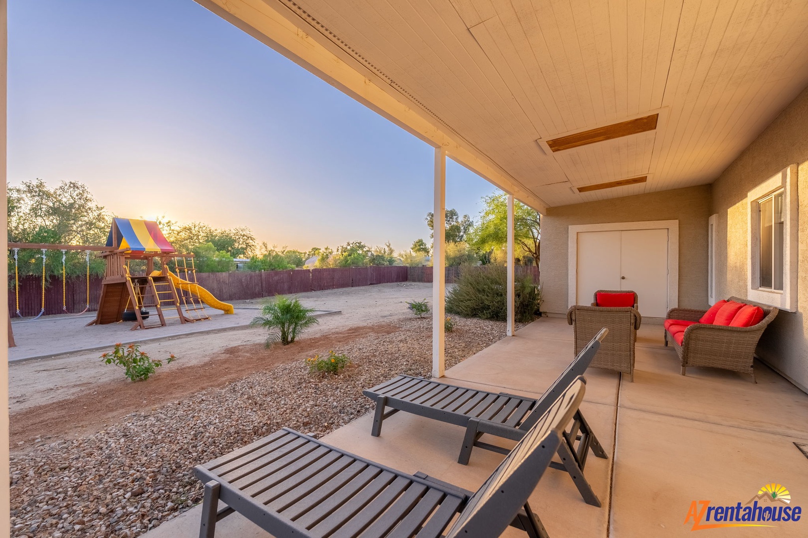 Soak up peaceful sunrises from your private covered patio, where lounge chairs and cozy seating invite you to unwind beside a spacious backyard with a kids' play area.