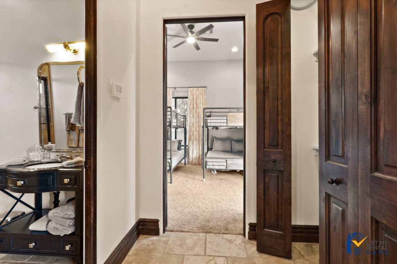 Your private bathroom features elegant fixtures and rich wood details, with easy access to comfortable bunk rooms for group stays.