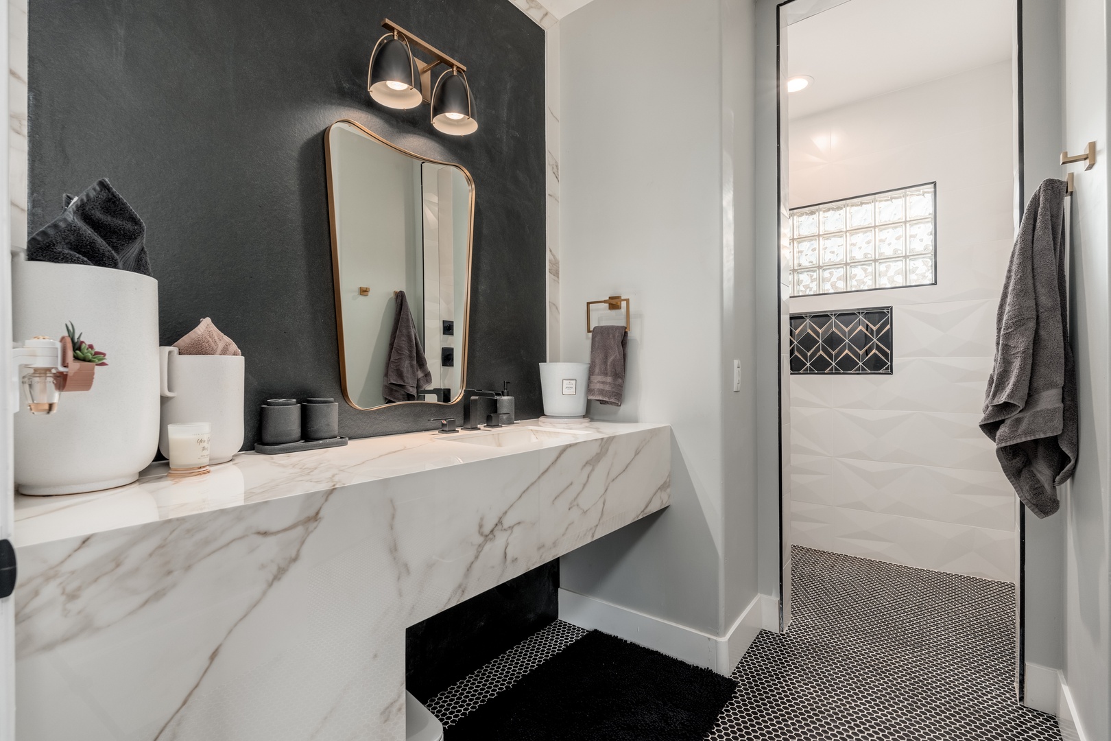 Step into your stylish private bathroom, where elegant marble meets modern design. Enjoy refreshing showers in a beautifully tiled space that feels both sophisticated and welcoming.