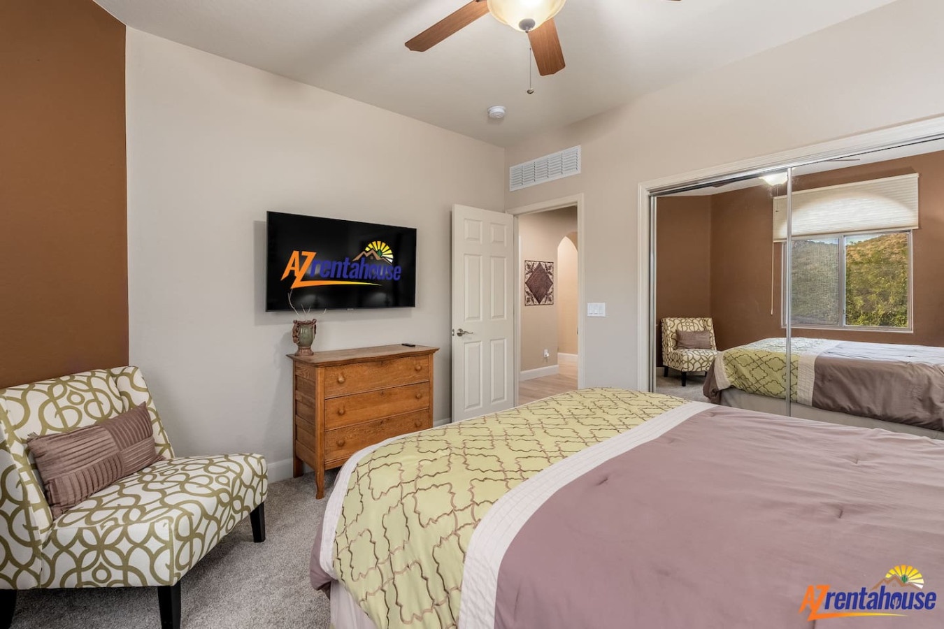Relax in your serene bedroom with a plush queen bed, cozy reading chair, and flat-screen TV for your comfort.