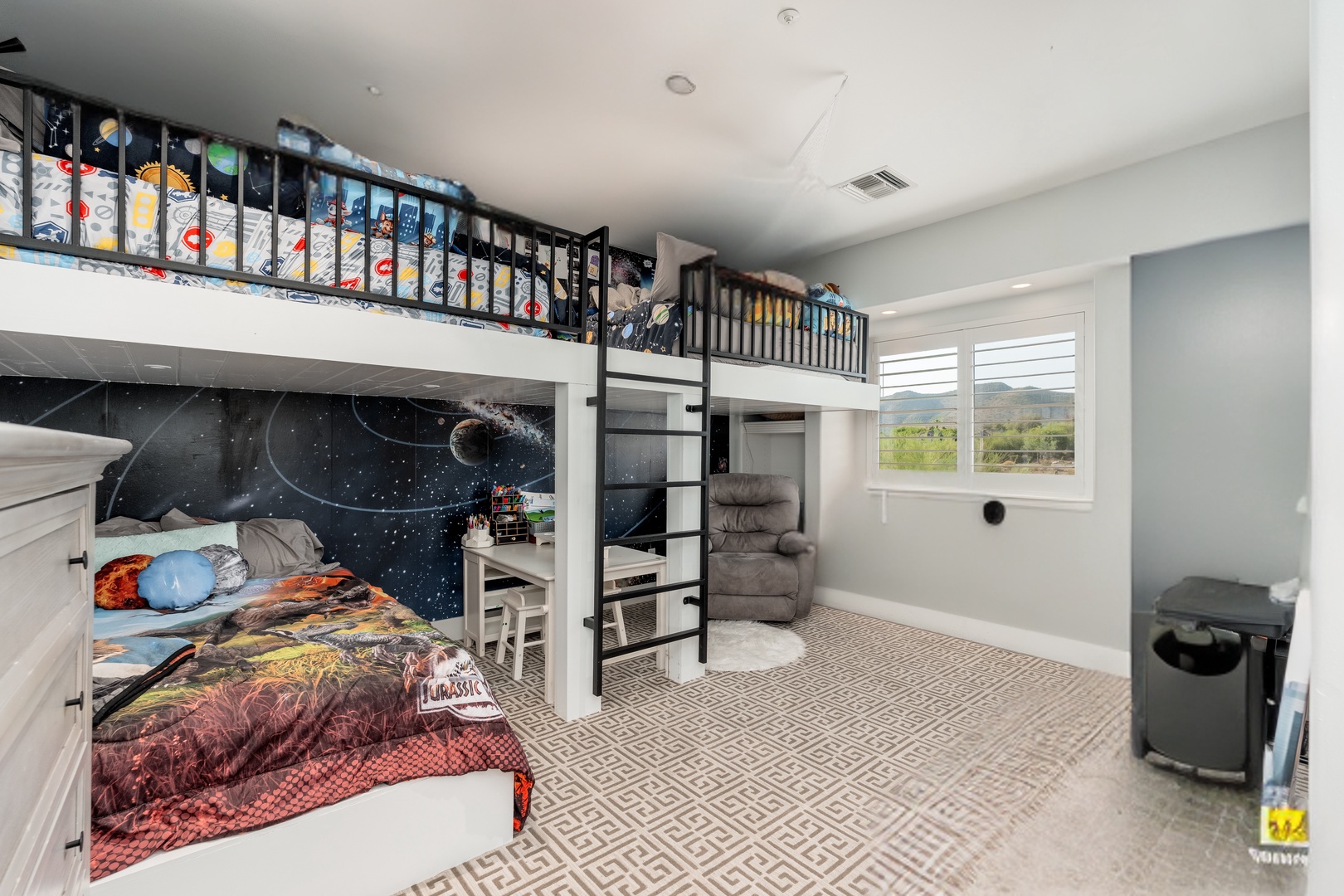 Your kids will love this space-themed bunk bed hideaway with cozy reading nooks and adventure-ready amenities.