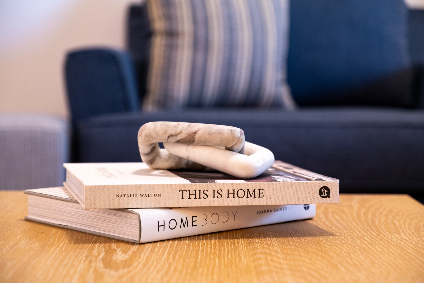 Sink into the plush sofa and enjoy your downtime with carefully curated design books—perfect for lazy afternoons with a cup of tea.