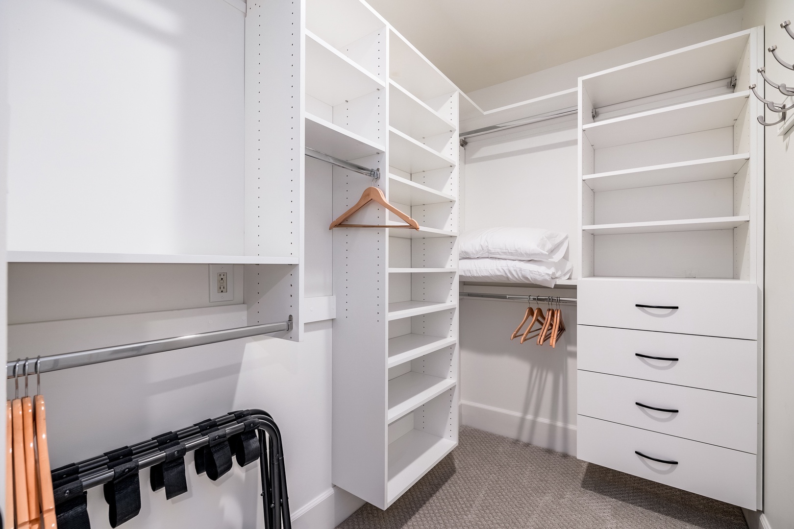 Unpack and settle into your spacious walk-in closet with custom shelving, hanging rods, and built-in drawers designed to keep your wardrobe organized throughout your stay.