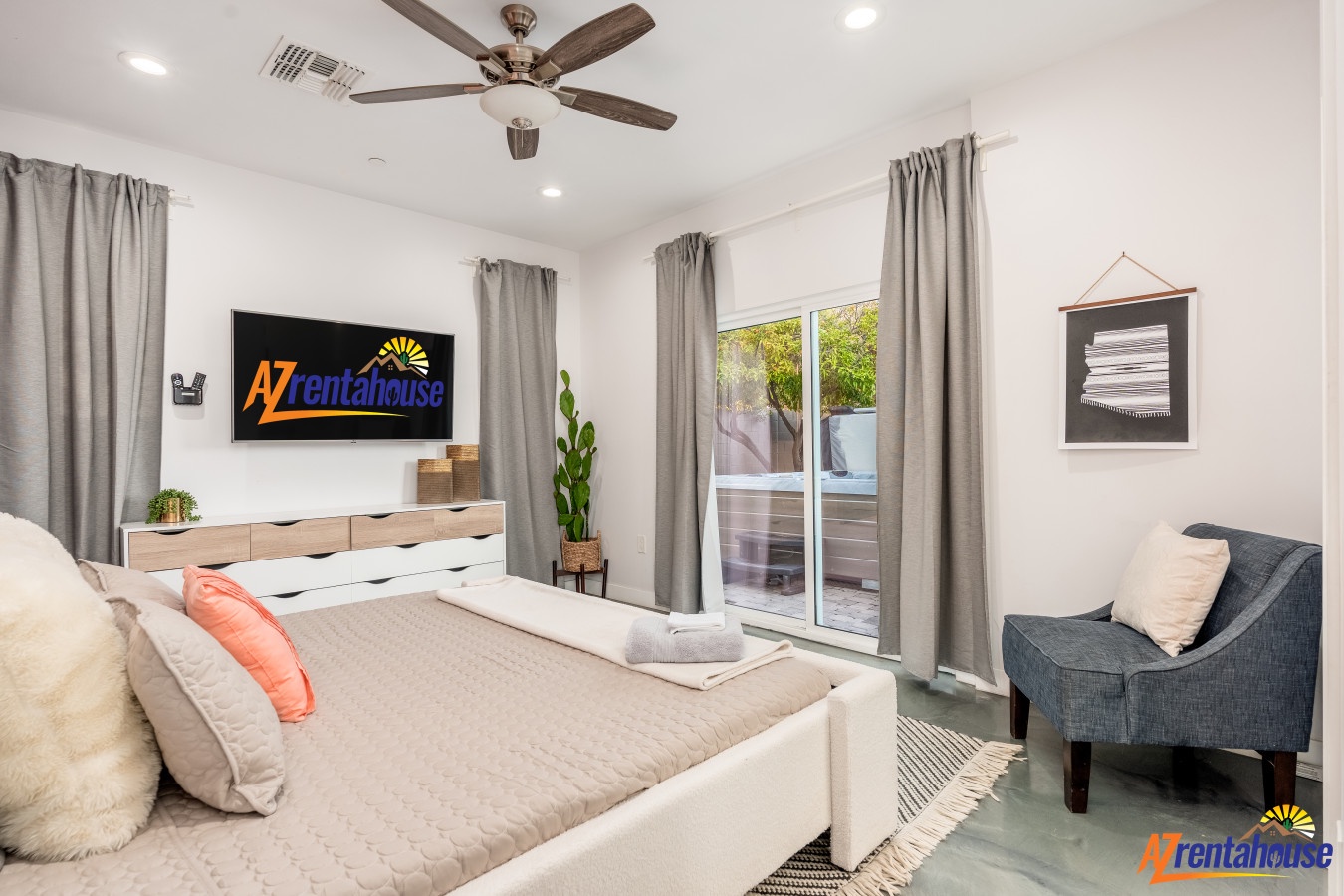 Unwind in your serene bedroom with plush bedding, modern TV, and private patio access—your perfect retreat awaits.