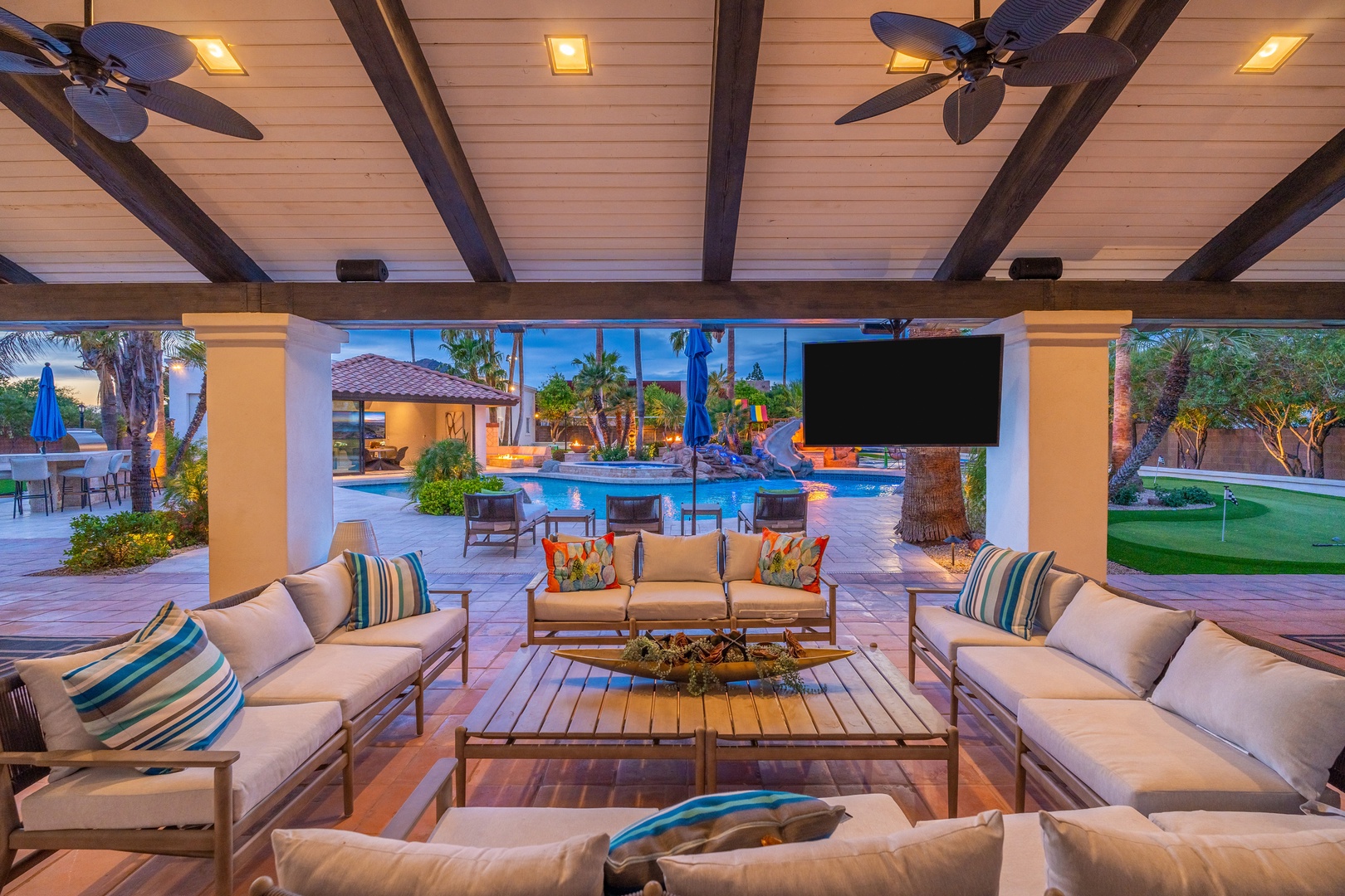Relax in this stunning covered patio where resort-style comfort meets elegant design—perfect for your evening gatherings under the stars.