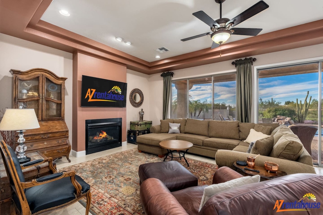 Unwind in your spacious living room where plush seating surrounds a cozy fireplace, perfect for memorable evenings together.
