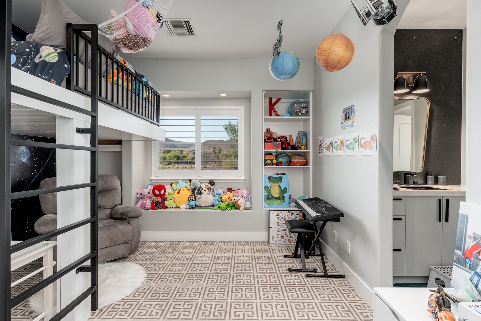 This playful bedroom offers comfy bunk beds, a cozy window seat with plenty of toys, and colorful décor that sparks imagination. Perfect for young adventurers!