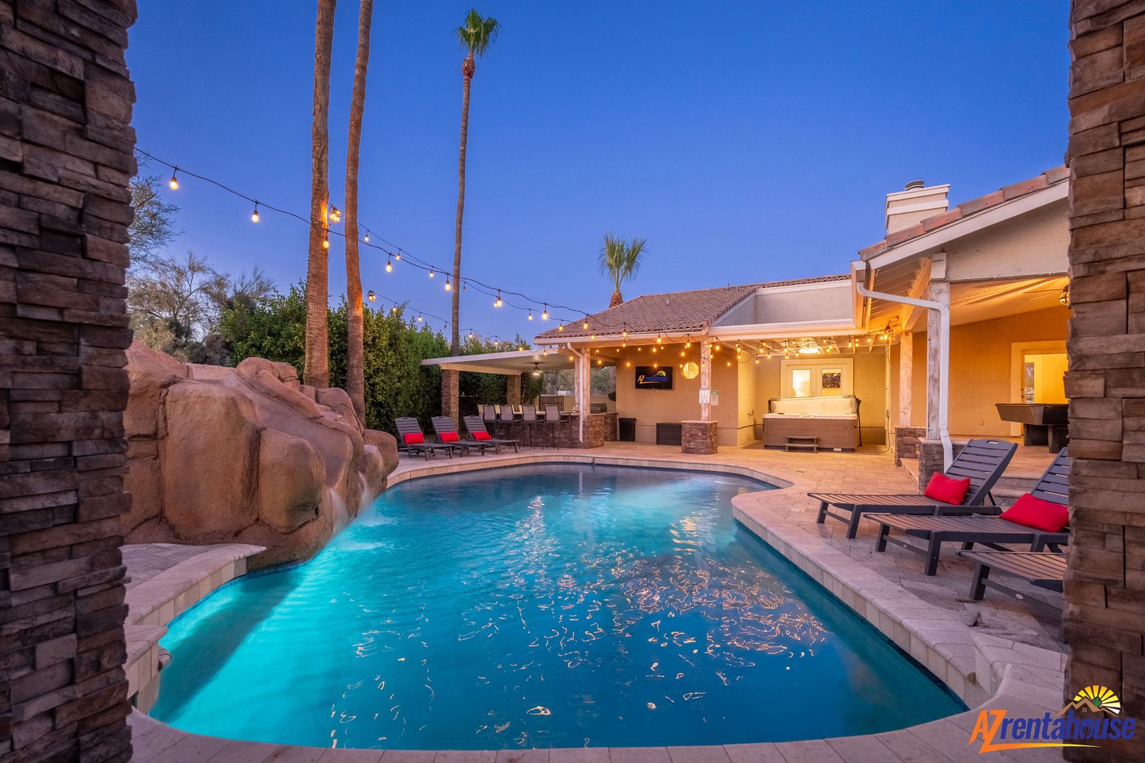 Dive into your private oasis as twilight falls—sparkling pool, cozy loungers, and warm string lights set the stage for unforgettable evenings under swaying palms.
