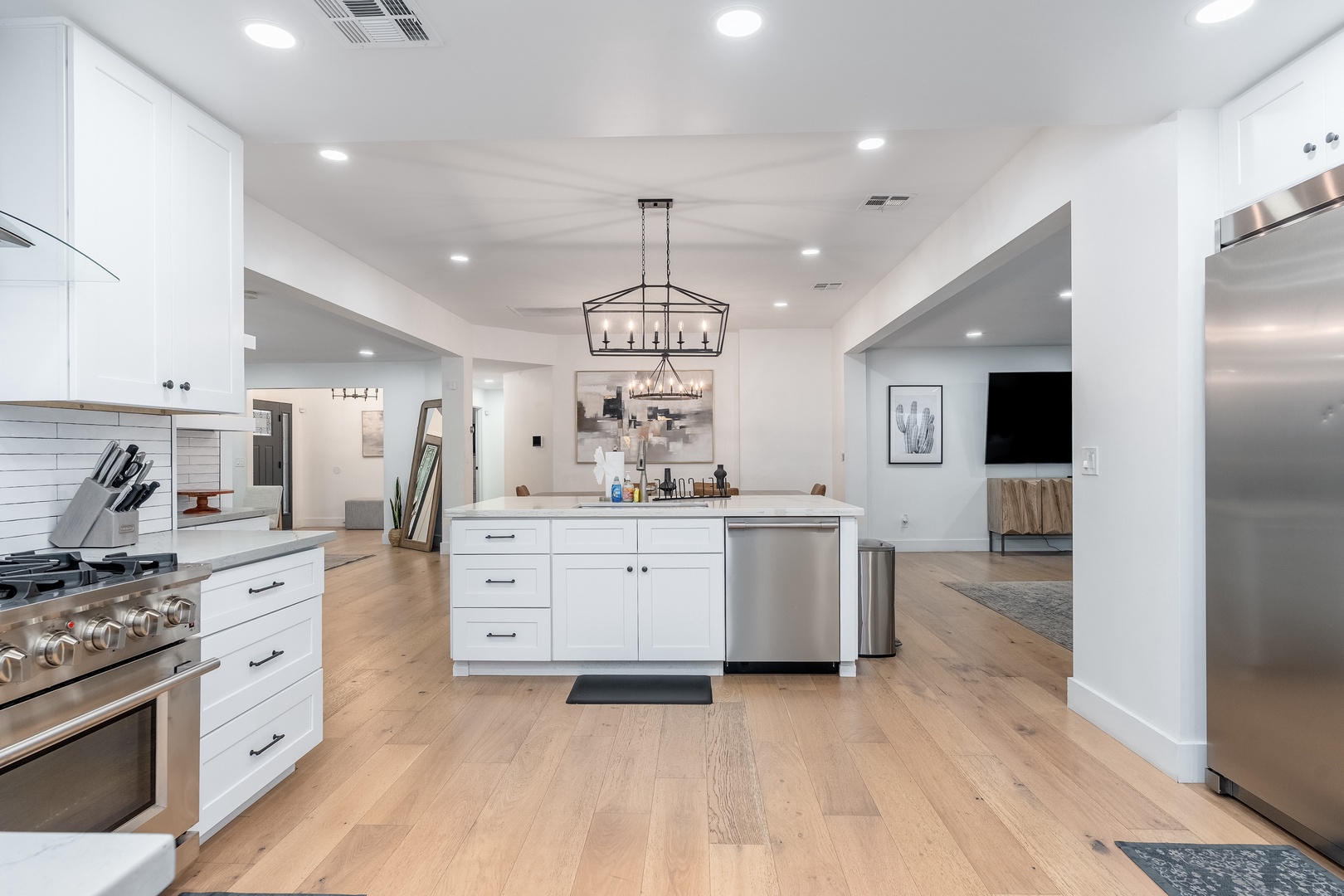 Your bright, open kitchen seamlessly connects to inviting living spaces, perfect for gathering, cooking, and making memories during your stay.