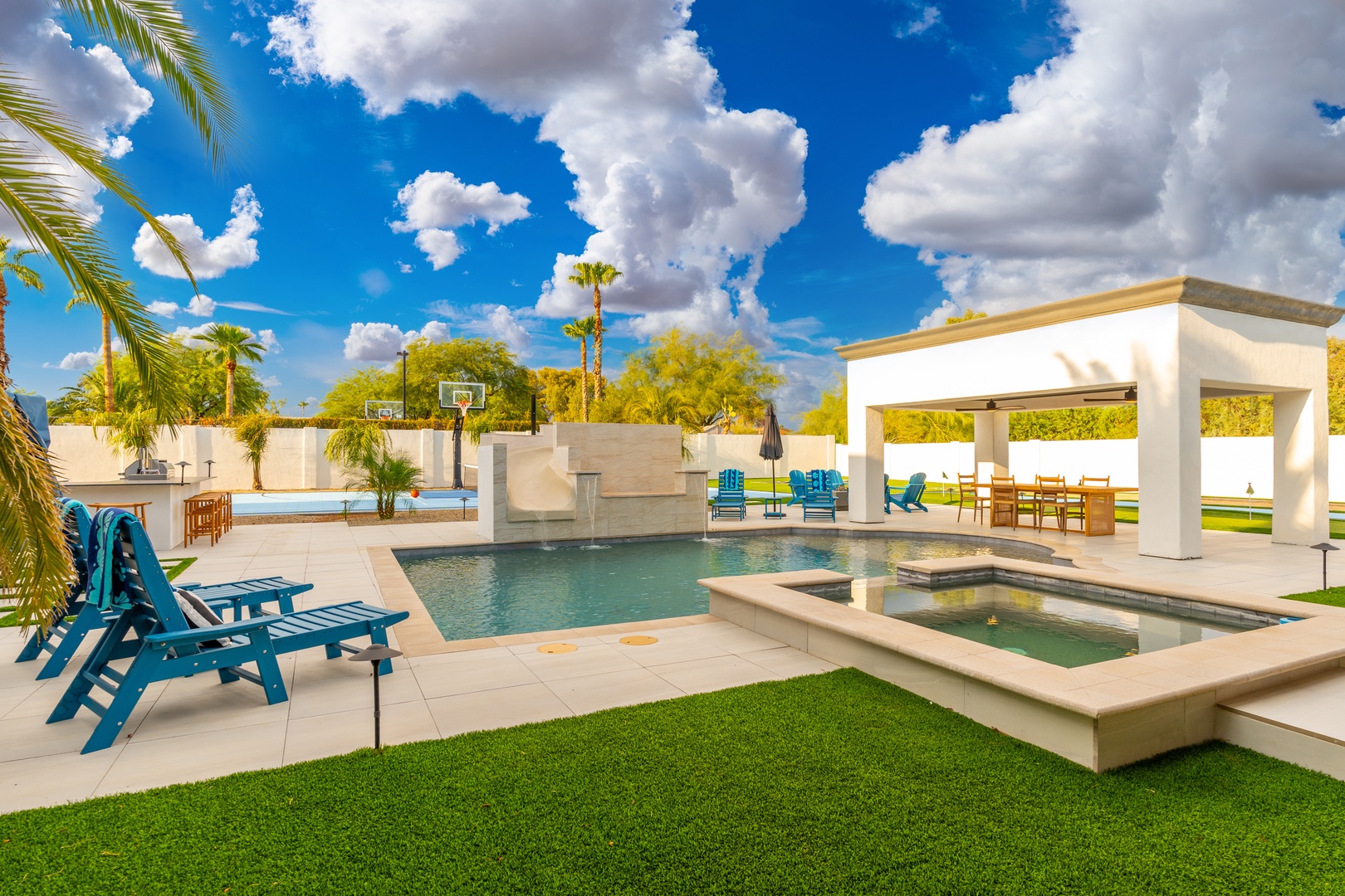 Stretch out on vibrant lounge chairs by your private pool, dive into cool blue waters, soak in the spa, or relax under the shaded pergola—your personal desert oasis awaits.