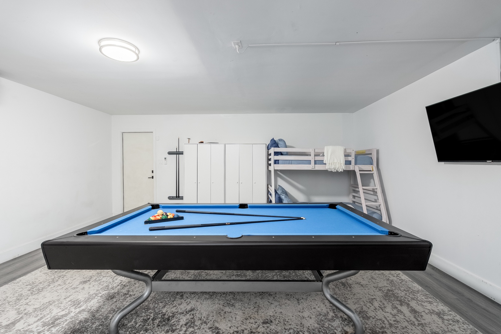 Challenge your friends to a game on your private full-size billiard table, or unwind watching the wall-mounted TV from the cozy bunk beds—your perfect space for fun and relaxation.