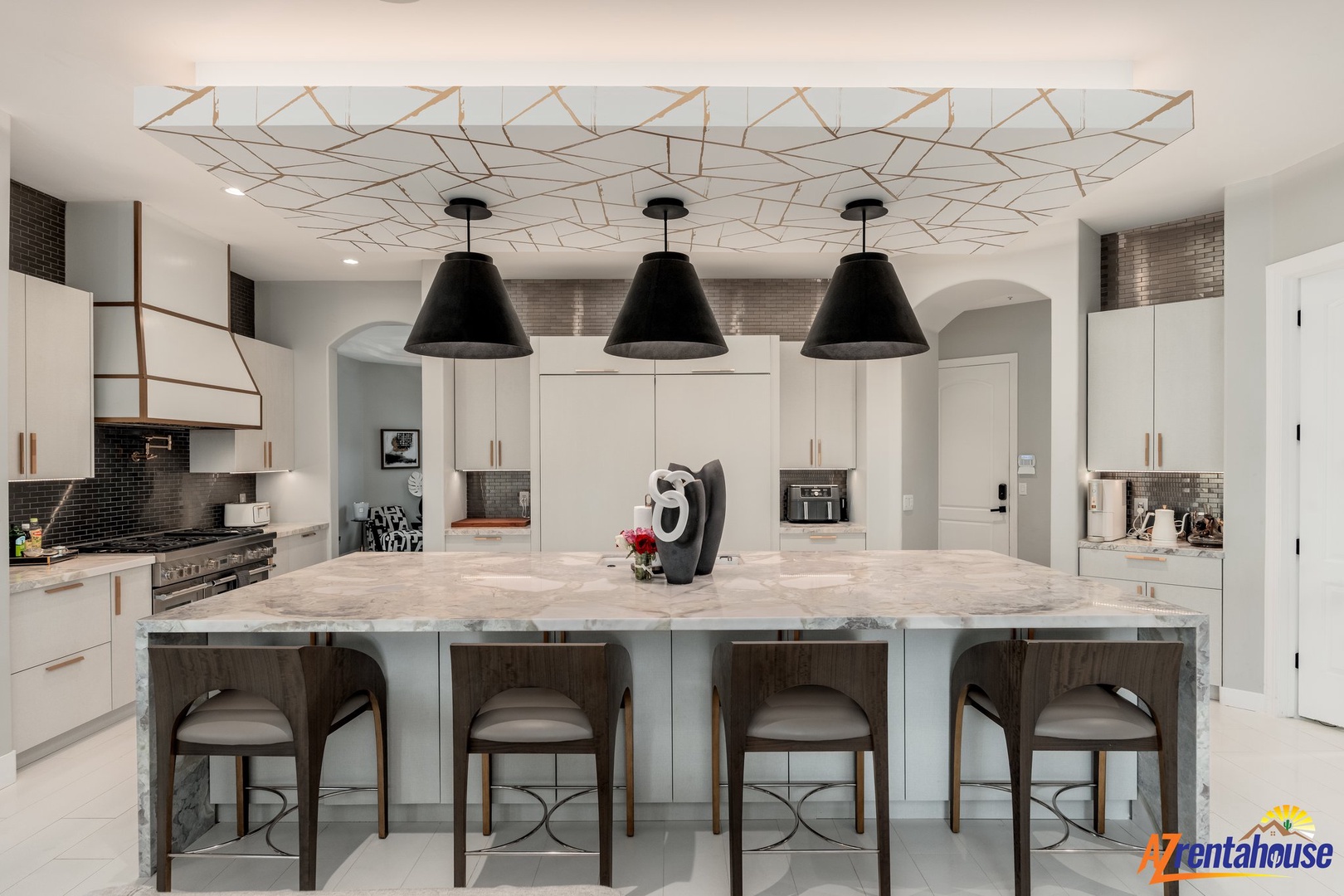 Your gourmet kitchen awaits with marble island seating, designer pendant lights, and premium appliances for memorable meal preparations.