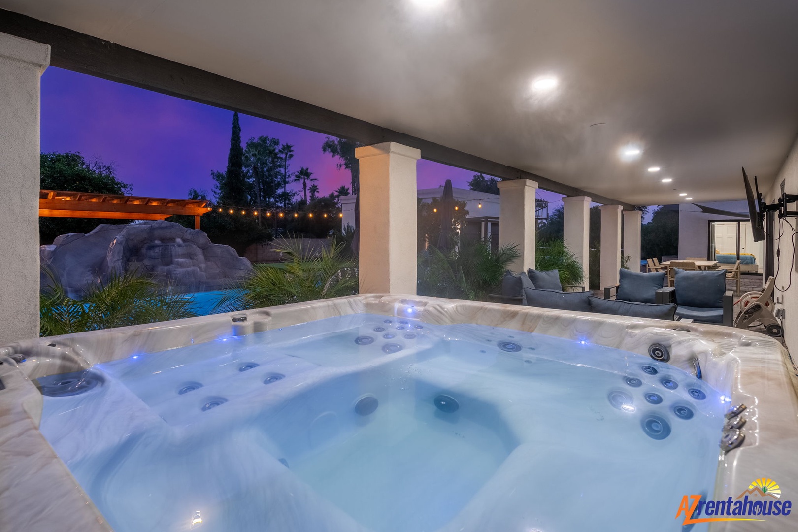Soak your stresses away in your private hot tub while gazing at the stunning twilight views and tropical landscaping beyond.
