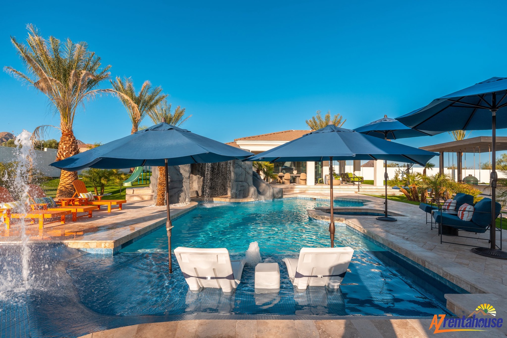 Stunning poolside paradise with resort-style amenities, tropical palm trees, and crystal-clear waters under endless blue skies.