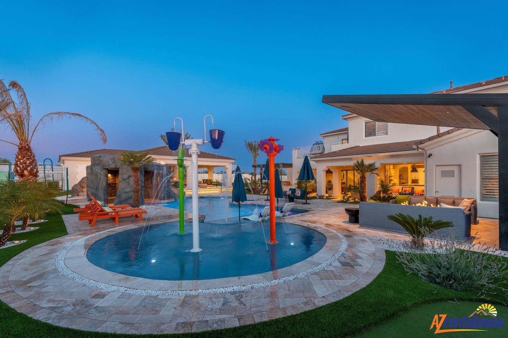 Modern villa with dedicated children's play pool featuring colorful water features and splash zones for endless family fun.